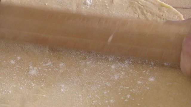 put the flour in the  fresh dough and pass a rolling pin