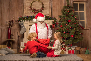 Santa Claus showing Christmas presents