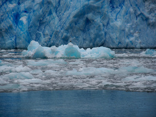Chunks of ice and drifting on sea near glaciers