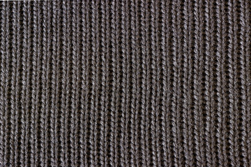 Black knitted fabric. Seamless texture.