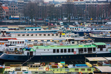 Fototapeta na wymiar Ships on the canals in Amsterdam. City landscape. Winter season