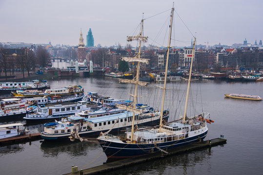 Ships on the canals in Amsterdam. City landscape. Winter season