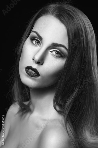 "Black and white beauty portrait of a beautiful sexy girl on a black