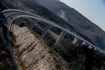 Tall highway road bridge with vehicles