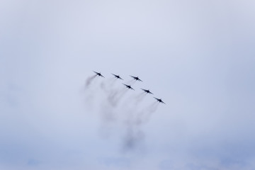 Air show in the sky above the Krasnodar airport flight school. Airshow in honor of Defender of the Fatherland. MiG-29 in the sky.