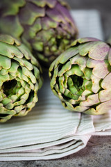 artichokes on wooden board