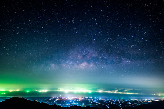 Night landscape with colorful Milky Way