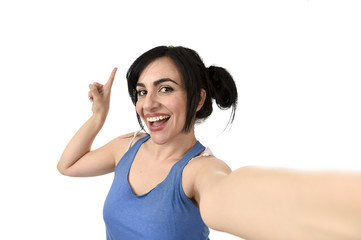 Naklejka premium sexy woman taking selfie photo with stick and mobile phone camera posing happy