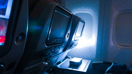 dim lights in the cabin of passenger aircraft during long-distance flights, passengers are rest