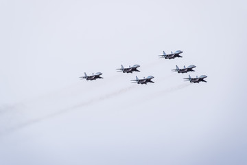 Air show in the sky above the Krasnodar airport flight school. Airshow in honor of Defender of the...