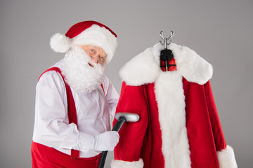 Santa Claus cleaning coat