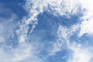 blue sky background with tiny clouds