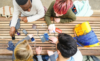 Top view of multiracial friends using mobile smart phone - Addiction concept with young people on...