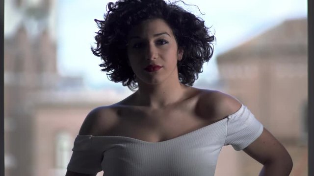 provocative and sensual woman dancing flirting with the camera