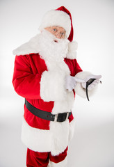 Santa Claus pointing on smartwatch