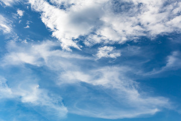 blue sky background with tiny clouds