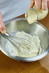 chef whisk mayonnaise in a bowl in hand a series of full cooking food recipes