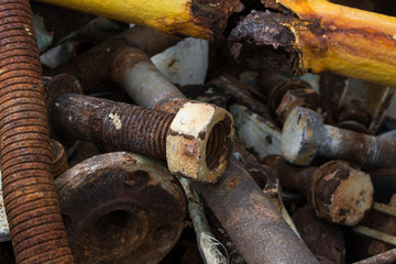 Pile of construction metals in factory. Steel tubes, iron pipes and bars.