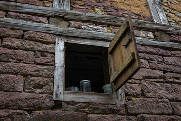 The wall and window of an old farmhouse