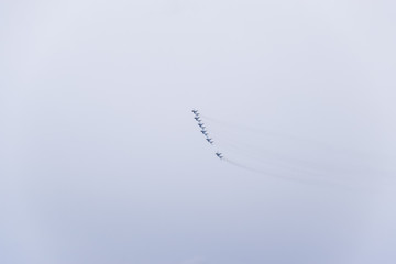 Air show in the sky above the Krasnodar airport flight school. Airshow in honor of Defender of the...