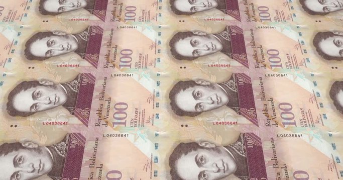 Banknotes of one hundred Venezuelan bolivars rolling on screen, cash money, loop