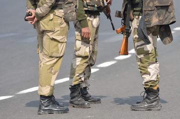 Security men with assault rifle.