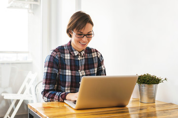 Fototapeta premium Young woman working in home office