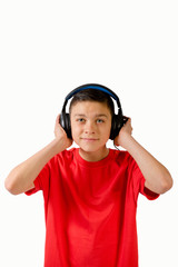 Teenage boy listening to music through headphones