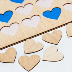 Carved small wooden hearts on table