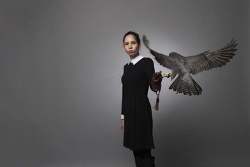 Girl and peregrine studio shooting