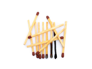 Laid used matchsticks isolated on white background