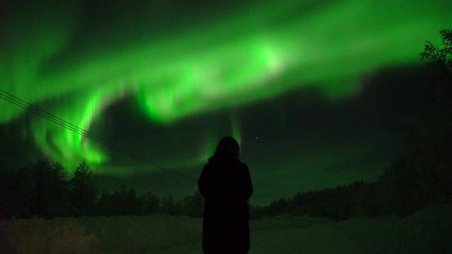 The Northern Lights on a road at night, Sweden