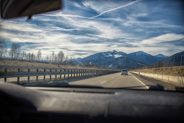 highway in the Alps. view from inside car,