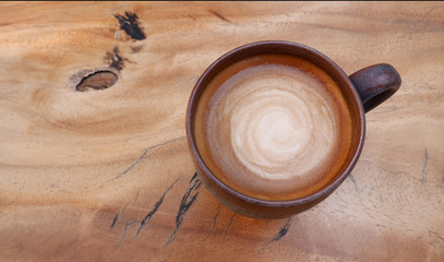 Obraz na płótnie Canvas Top view of hot coffee cappuccino on wood table background