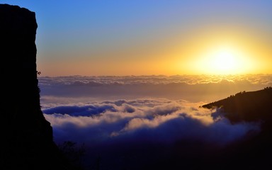 Sunrise over the sea of clouds, summit of Gran canaria, Canary islands