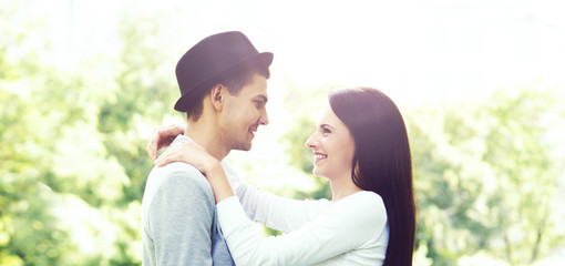 Fototapeta premium Young beautiful couple of hipsters: hugging in the park. Love, relationship, dating: concept.