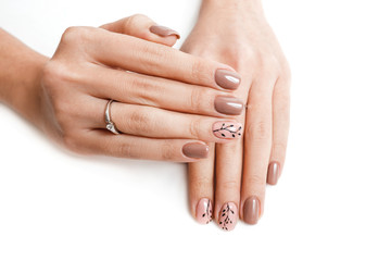 Female hand with nail art isolated on a white background
