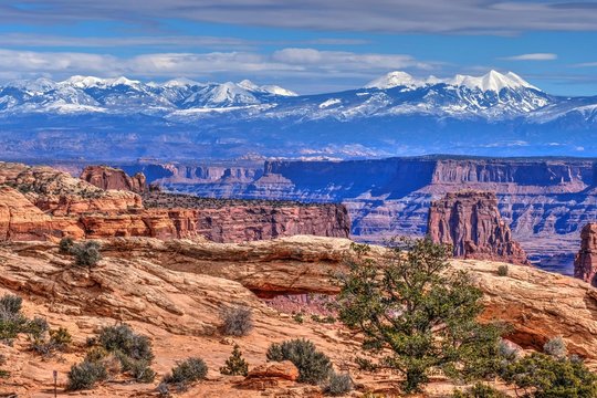La Sal Mountains and Mesa Arch. Canyonlands National Park. Moab. United States.