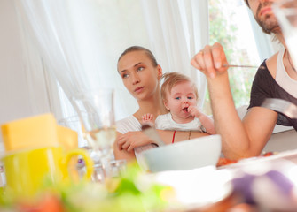 Obraz na płótnie Canvas Baby eating family restaurant