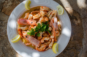 boiled shrimps with olive oil and lemon common dish for seafood lovers.  Delicious appetizer goes together with ouzo,raki,tsipouro. Tasty recipe for fasting period and lent.