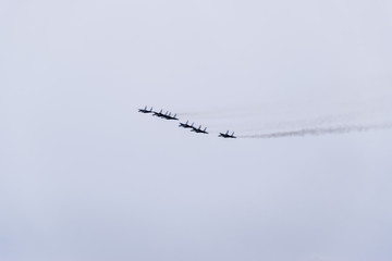 Air show in the sky above the Krasnodar airport flight school. Airshow in honor of Defender of the...