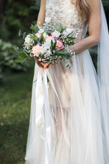 the bride holding a bouquet.