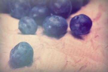 Fresh blueberries on a rustic brown paper background