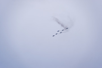 Air show in the sky above the Krasnodar airport flight school. Airshow in honor of Defender of the Fatherland. MiG-29 in the sky.