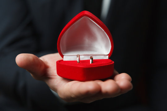 Wedding rings in red heart shaped box