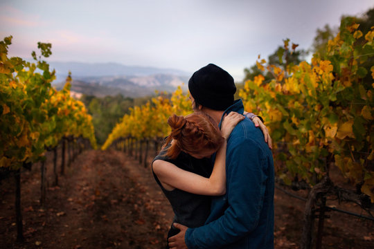 Man and woman embracing in vineyard