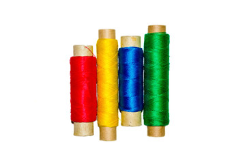 
shvnynye colored thread on a white background