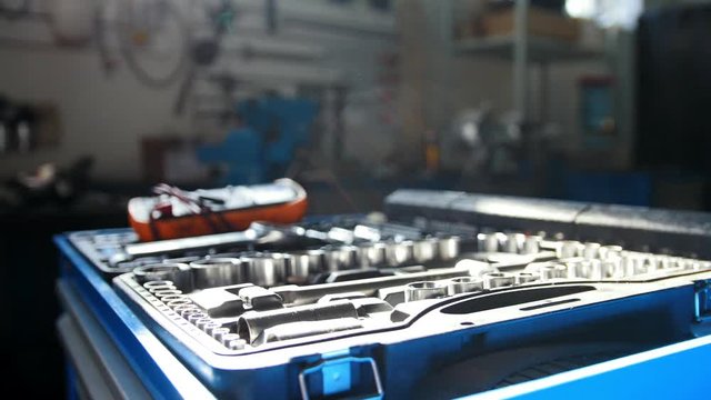 A set of tools for repair - screwdriver, voltmeter, wrenches - car service at sunny day