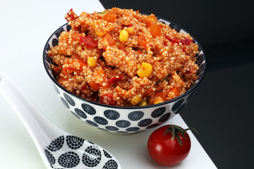 Delicious vegetarian quinoa salad with bell pepper, cucumber and tomatoes