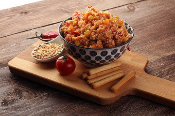 Delicious vegetarian quinoa salad with bell pepper, cucumber and tomatoes